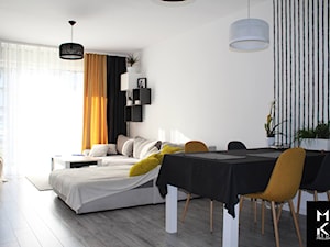 Mieszkanie nowoczesne - Mały biały salon z jadalnią, styl nowoczesny - zdjęcie od MIKA Studio Projektowe