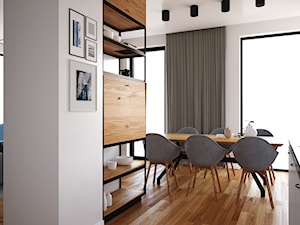 Dom w stylu nowoczesnym - Średnia biała jadalnia w salonie w kuchni, styl nowoczesny - zdjęcie od kfprojekty