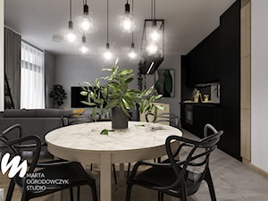 Mieszkanie z czerwoną cegłą w Łodzi - Średnia biała jadalnia w salonie w kuchni, styl industrialny - zdjęcie od Marta Ogrodowczyk Studio