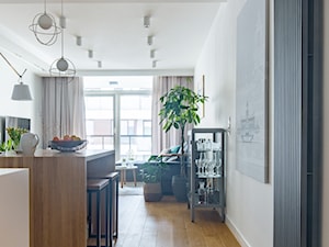 WILANÓW - realizacja - Średni biały salon z kuchnią z jadalnią z barkiem, styl minimalistyczny - zdjęcie od INVENTIVE studio