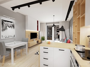 KONTRASTY - Mała otwarta z salonem szara z zabudowaną lodówką kuchnia w kształcie litery l z oknem, styl nowoczesny - zdjęcie od INVENTIVE studio