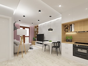 Mieszkanie z różowym akcentem. - Mały szary salon z kuchnią z jadalnią, styl skandynawski - zdjęcie od INVENTIVE studio