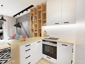 KONTRASTY - Mała otwarta z salonem biała z zabudowaną lodówką kuchnia w kształcie litery l z oknem, styl nowoczesny - zdjęcie od INVENTIVE studio
