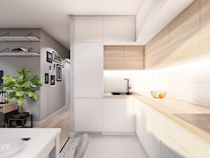 MIESZKANIE KRAKÓW - Średnia otwarta z salonem biała szara z zabudowaną lodówką z nablatowym zlewozmywakiem kuchnia w kształcie litery l, styl minimalistyczny - zdjęcie od INVENTIVE studio