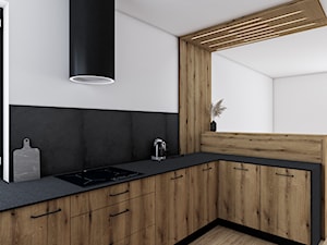 Coast Evoke | Lamela - Średnia otwarta z kamiennym blatem czarna z okapem kuchnia w kształcie litery l z kompozytem na ścianie nad blatem kuchennym, styl nowoczesny - zdjęcie od Vimko Projektowanie Wnętrz