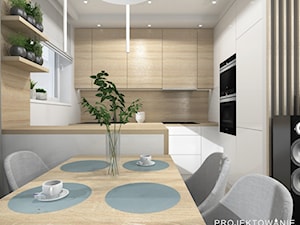 Aneks kuchenny w salonie - Mała zamknięta szara z zabudowaną lodówką z nablatowym zlewozmywakiem kuchnia w kształcie litery l z oknem - zdjęcie od Projektowanie Wnetrz Online