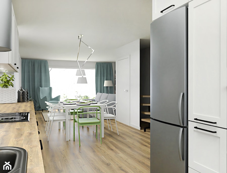Kuchnia w domu - Mała otwarta z salonem biała z zabudowaną lodówką z nablatowym zlewozmywakiem kuchnia dwurzędowa z oknem - zdjęcie od Projektowanie Wnetrz Online