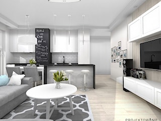 Projekt salonu z kuchnią w szarości i bieli ze ściana z białych kafelków 