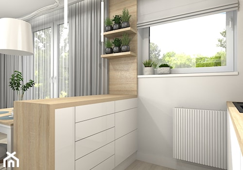 Aneks kuchenny w salonie - Mała otwarta biała z nablatowym zlewozmywakiem kuchnia dwurzędowa z oknem - zdjęcie od Projektowanie Wnetrz Online