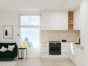 Projekt mieszkania z zieloną sofą - Mała z salonem beżowa z zabudowaną lodówką z nablatowym zlewozmywakiem kuchnia w kształcie litery l z oknem, styl nowoczesny - zdjęcie od Projektowanie Wnetrz Online