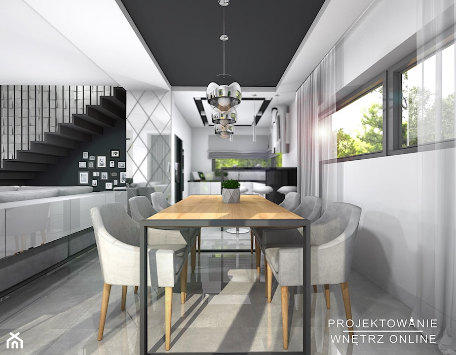 Salon z kuchnią i jadalnią - Duża biała czarna jadalnia w salonie w kuchni, styl nowoczesny - zdjęcie od Projektowanie Wnetrz Online