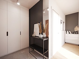 Projekt małego mieszkania w bieli i drewnie z akcentami czerni - Hol / przedpokój, styl nowoczesny - zdjęcie od Projektowanie Wnetrz Online