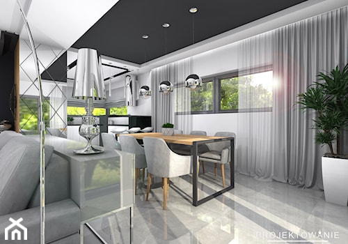 Salon z kuchnią i jadalnią - Średnia biała czarna jadalnia w salonie w kuchni, styl nowoczesny - zdjęcie od Projektowanie Wnetrz Online