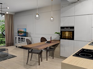 pokój dzienny z chabrową pikowaną kanapą Chesterfield - Średni biały salon z kuchnią z jadalnią, styl nowoczesny - zdjęcie od Krawczyszyn-design