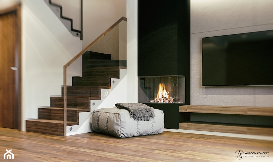 Minimalistyczny salon z czarnym kominkiem i betonem architektonicznym - zdjęcie od Auroom Concept