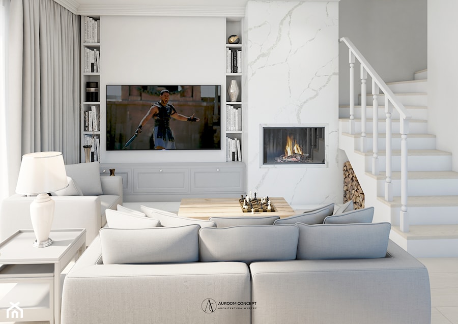 Jasny salon z marmurowym kominkiem - zdjęcie od Auroom Concept
