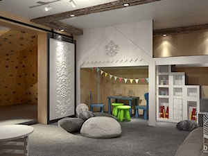 pomieszczenie ze ścianką wpsinaczkową i kącik zabaw dla dzieci w górskim pensjonacie - zdjęcie od balhouse - projektowanie wnętrz