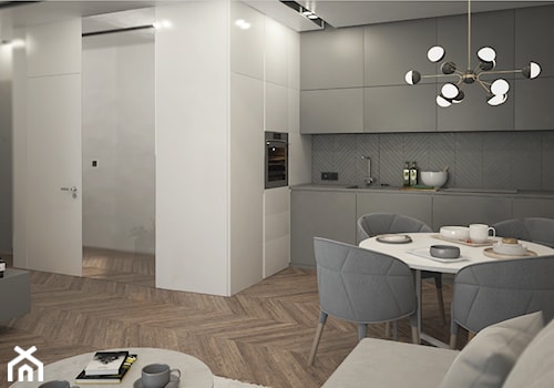 Mieszkanie 40 m2 - Średnia szara jadalnia w salonie w kuchni - zdjęcie od mrior