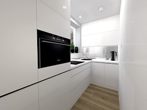 Biało-czarna kuchnia ze srebrnymi dodatkami - zdjęcie od sandroom