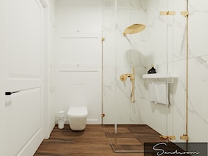 Łazienka z marmurem i złotymi akcentami - zdjęcie od sandroom
