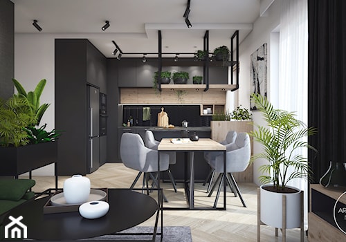 Mieszkanie w ciemnych barwach z dodatkiem zieleni - Średnia biała czarna jadalnia w salonie w kuchni, styl nowoczesny - zdjęcie od DEZEEN ARCHITEKCI Natalia Pęcka