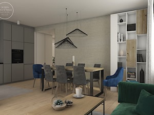 Mieszkanie w stylu skandynawskim - Średnia jadalnia w salonie w kuchni, styl skandynawski - zdjęcie od DEZEEN ARCHITEKCI Natalia Pęcka