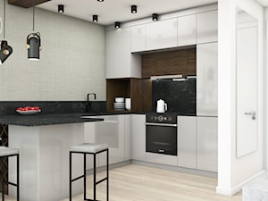 Mieszkanie Black&White - Średnia otwarta z salonem z kamiennym blatem biała z zabudowaną lodówką z nablatowym zlewozmywakiem kuchnia w kształcie litery l z marmurem nad blatem kuchennym, styl nowoczesny - zdjęcie od DEZEEN ARCHITEKCI Natalia Pęcka