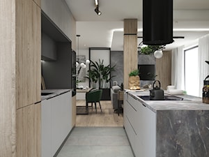 Mieszkanie z nowoczesną i przestronną kuchnią - Średnia otwarta z salonem szara z zabudowaną lodówką kuchnia dwurzędowa z oknem, styl minimalistyczny - zdjęcie od DEZEEN ARCHITEKCI Natalia Pęcka
