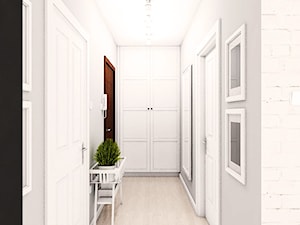 Aranżacja mieszkania w Pruszczu Gdańskim - Duży biały szary hol / przedpokój, styl skandynawski - zdjęcie od Szlachta Pracownia Projektowa