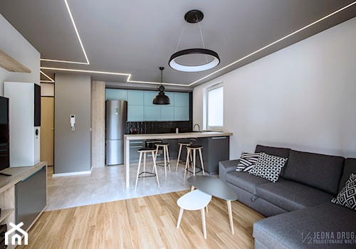 Mieszkanie pod wynajem, Oliwa - realizacja - Średni biały szary salon z kuchnią z jadalnią, styl nowoczesny - zdjęcie od JEDNA DRUGA