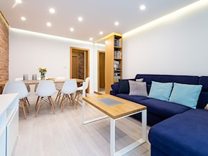 Realizacja projektu mieszkania w Zabrzu - Mały biały salon z jadalnią - zdjęcie od Wawoczny Architekt