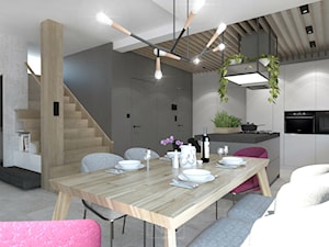 Dom, w którym szlachetne materiały spotykają nowoczesne formy - Średnia szara jadalnia w salonie w kuchni - zdjęcie od GRUPA NONO