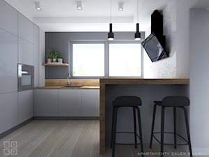 Apartament II Zalesie - Średnia otwarta szara z zabudowaną lodówką z nablatowym zlewozmywakiem kuchnia w kształcie litery l z oknem, styl skandynawski - zdjęcie od Studio Soko