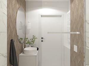 Biała łazienka z drewnem - zdjęcie od MACZ Architektura