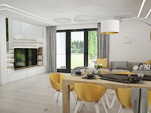 Dom ECO-02 - Duży biały salon z jadalnią z tarasem / balkonem z bibiloteczką, styl nowoczesny - zdjęcie od Pracownia architektoniczna - LARYSZ