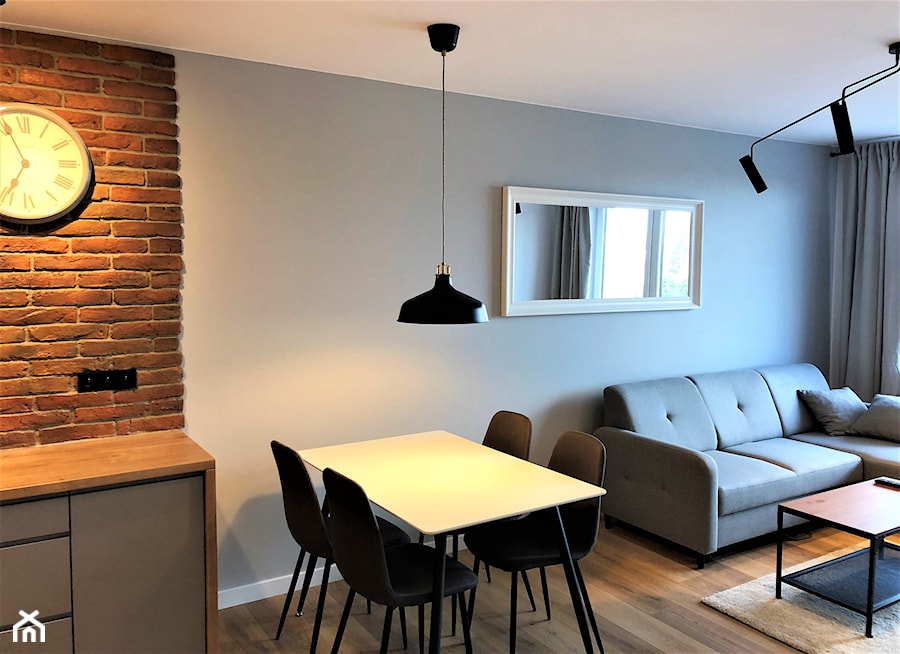 Realizacja - oryginalne mieszkanie na wynajem - Mały szary salon z kuchnią z jadalnią, styl nowoczesny - zdjęcie od DekoDeko