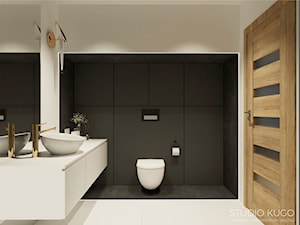 Dom w Orzeszu - Średnia z lustrem łazienka - zdjęcie od STUDIO KUGO