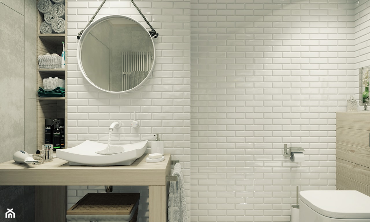 białe płytki cegiełkowe w łazience, okrągłe lustro w białej ramie, kwadratowa umywalka nablatowa