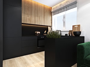 Mieszkanie z zielonym akcentem - Średnia otwarta z salonem z kamiennym blatem biała czarna z zabudowaną lodówką kuchnia w kształcie litery u, styl nowoczesny - zdjęcie od Ambience. Interior design