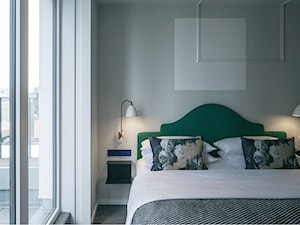 Aranżacje - Mała szara sypialnia, styl nowoczesny - zdjęcie od JUNG Polska