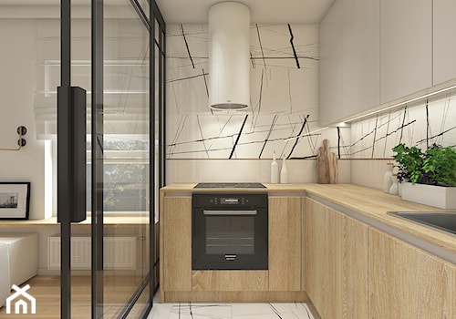Mieszkanie w krakowie 50 m2 - Mała otwarta z salonem szara z zabudowaną lodówką z nablatowym zlewozmywakiem kuchnia w kształcie litery l z oknem z marmurem nad blatem kuchennym, styl nowoczesny - zdjęcie od WERDHOME