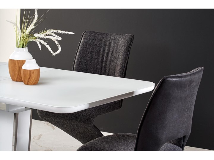 Biały stół rozkładany Bonari z chromowanymi wstawkami Szerokość 90 cm Długość 200 cm  Rozkładanie Rozkładane Wysokość 60 cm Szkło Płyta MDF Szerokość 160 cm Metal Długość 160 cm  Styl Glamour